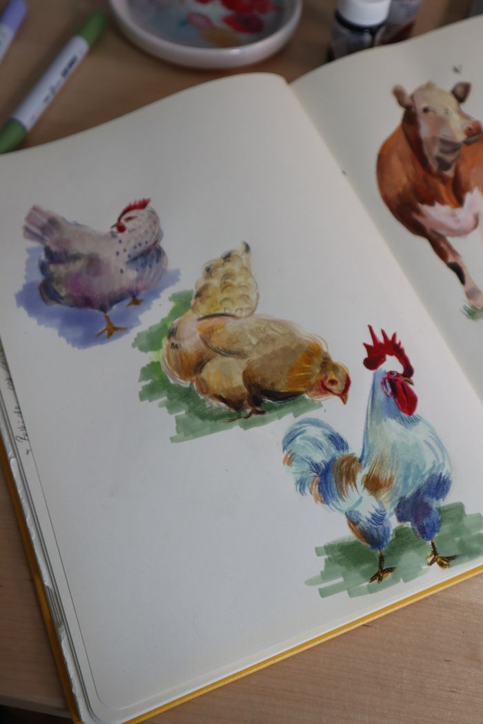 Offerings Open sketchbook showing watercolor illustrations of farm animals like chickens and a cow.