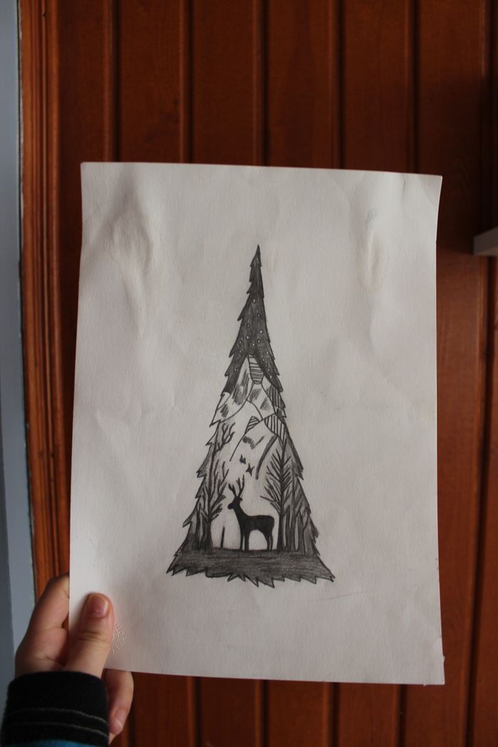 Offerings Artistic sketch of forest and deer on paper held by hand, depicting nature.